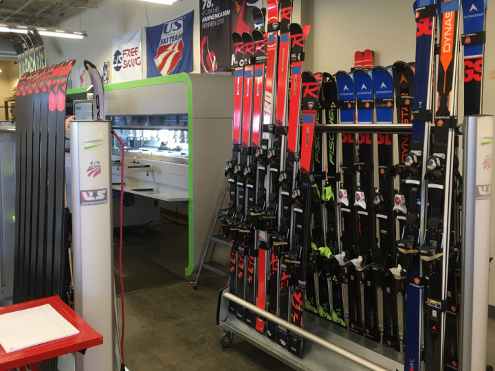 Skis waiting to be ground on the WINTERSTEIGER Jupiter at the US Ski Team Center of Excellence